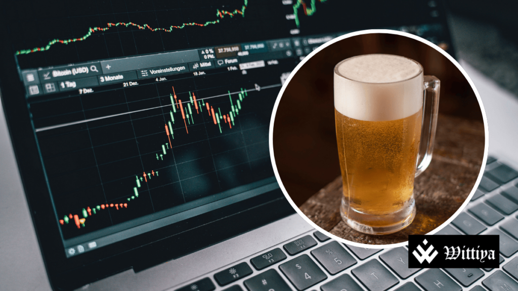 Share market board on a laptop alongside a glass of alcohol, symbolizing UBL's stock surge after beer supply resumption.