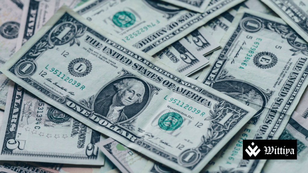 US dollars stacked, symbolizing the weakening of the US Dollar ahead of Trump’s inauguration.