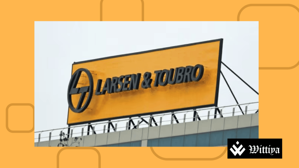 Board displaying L&T logo in relation to winning Oman Railway project, despite minor decline in shares