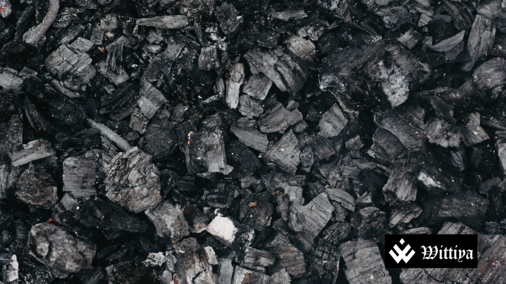 A stack of thermal coal being transported, representing India's declining coal imports.