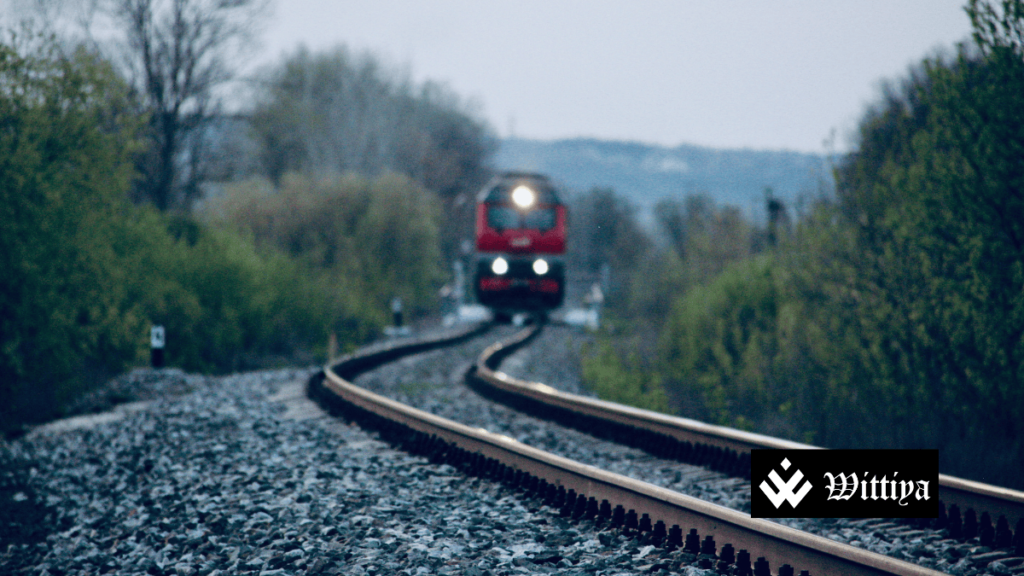 Railway tracks with a Rail Vikas Nigam logo, symbolizing the company’s stock rise following a ₹404 crore project announcement.