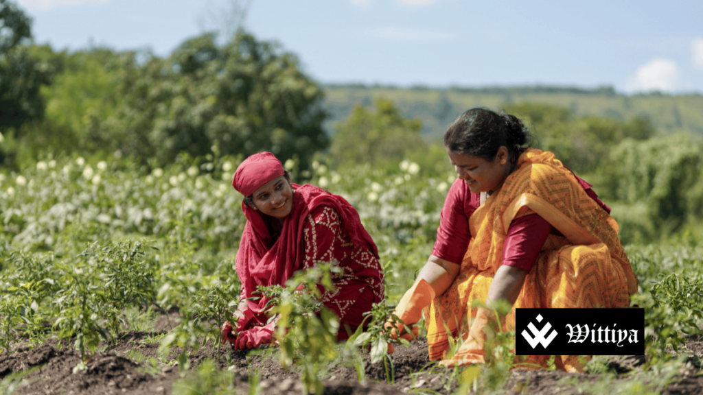 Women farmers working in the field, highlighting agricultural reforms