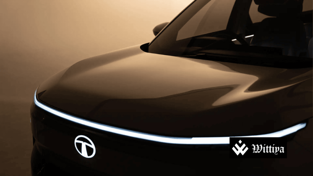 Tata Motors logo with Q3 earnings miss and guidance cut announcement