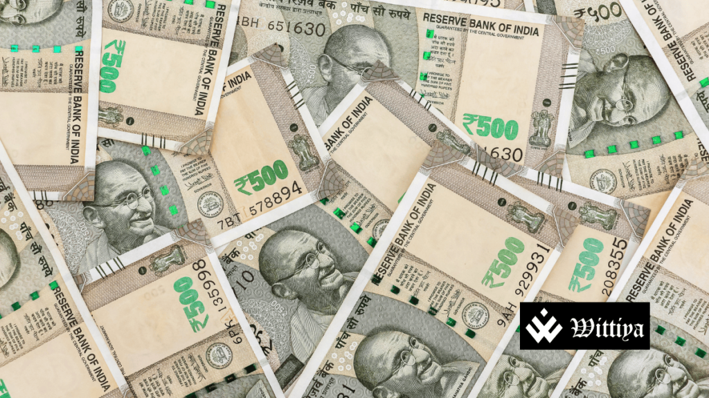Stacks of Indian currency notes, symbolizing India's fiscal deficit reaching 85.8% of the annual target by February 2025.