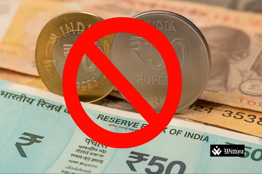 ₹50 coins stacked with dust, showing lack of circulation and public support